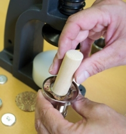 Hand button covering machine